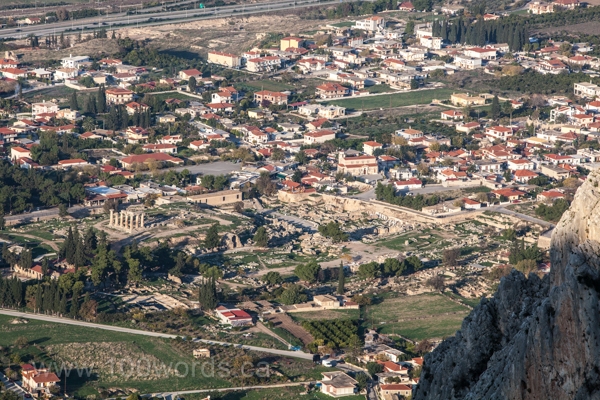 The ruins of Ancient Corinth (centre) are surround by a modern community that is just a few kilometres south-west of Modern Corinth. This view is from the Acropolis Hill (Acrocorinth).